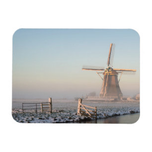 Windmill in the snow at sunrise rectangular magnet