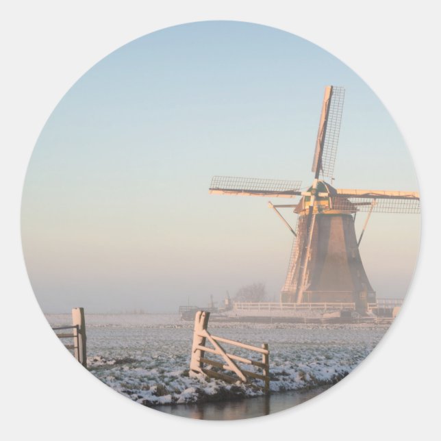 Windmill in the snow at sunrise round sticker (Front)