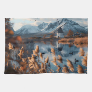 Windmill on a lake with mountains landscape tea towel