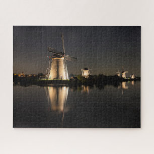 Windmills and water illuminated at night jigsaw puzzle