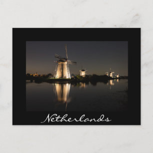 Windmills illuminated at night black postcard