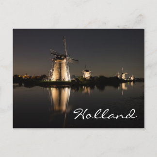 Windmills illuminated at night in Holland postcard