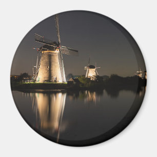 Windmills illuminated at night round magnet