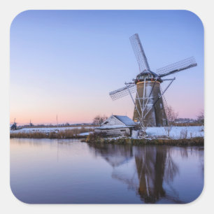 Windmills in winter during a sunrise sticker