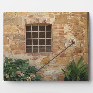 Window and ancient stone wall, Pienza, Italy Plaque