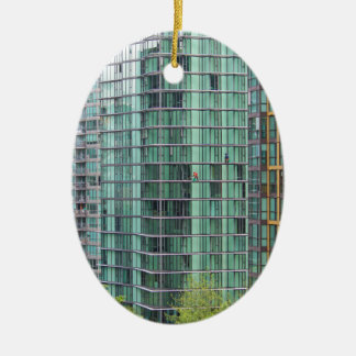 Window washers on downtown high rise building ceramic tree decoration