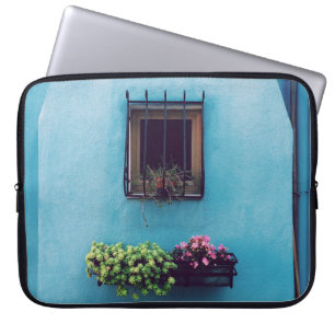 WINDOW WITH FRAME ABOVE GREEN AND PINK PETALED FLO LAPTOP SLEEVE