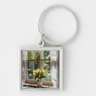 Window with lace curtain and tulips key ring