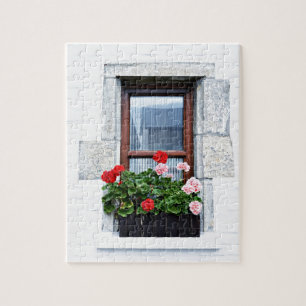 window with red flowers on white wall jigsaw puzzle