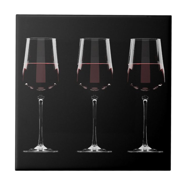 Wine glasses with red wine on black ceramic tile (Front)