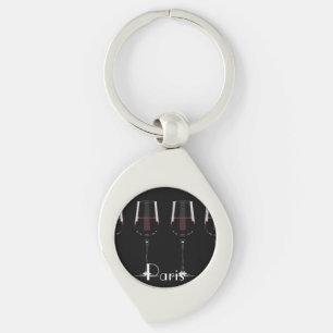 Wine glasses with red wine on black key ring