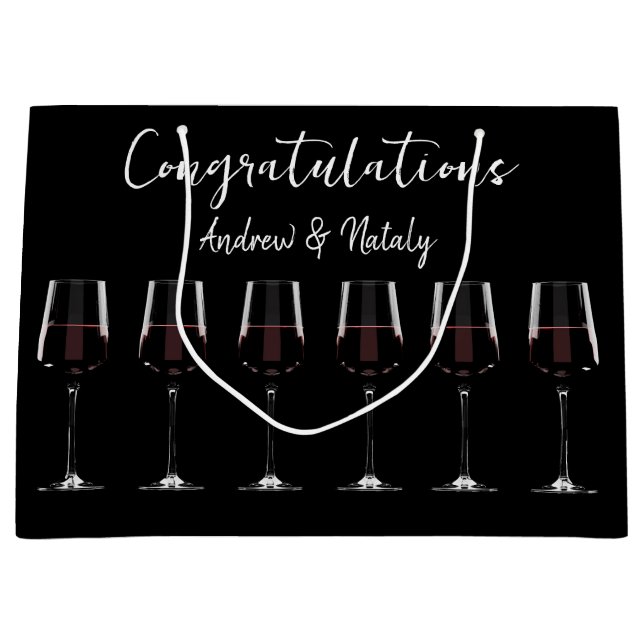 Wine glasses with red wine on black large gift bag (Front)