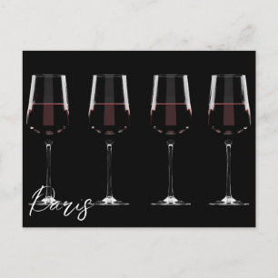 Wine glasses with red wine on black postcard