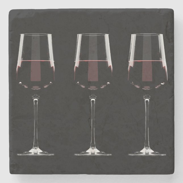 Wine glasses with red wine on black stone coaster (Front)