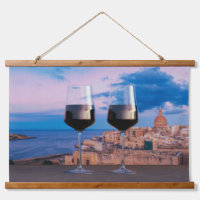 Wine glasses with view of sunset over Valletta