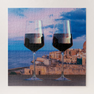 Wine glasses with view of sunset over Valletta Jigsaw Puzzle