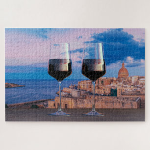 Wine glasses with view of sunset over Valletta Jigsaw Puzzle
