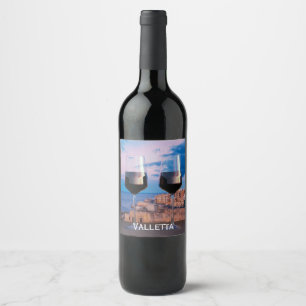 Wine glasses with view of sunset over Valletta Label