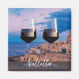 Wine glasses with view of sunset over Valletta Magnet