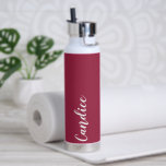 Wine Red Personalised Wedding Bridesmaid Water Bottle<br><div class="desc">Gift your wedding bridesmaid or maid of honour with this trendy, vacuum Insulated water bottle that features her name in white, stylised script on a wine red colour background designed to match your wedding colour scheme. Personalise bottle by editing and replacing name with your own as desired. Select your water...</div>