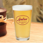 Wine Red Stylised Wedding Groomsman Name Glass<br><div class="desc">Beer glass for the wedding groomsman that features his name printed in a wine red colour, stylised script inside a wine red colour oval border along with wedding date. A great party supply idea for a bachelor party! Personalise your beer glass by editing and replacing name and date with your...</div>
