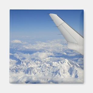 Wings of flying aeroplane over French Alps, Magnet