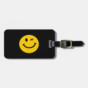Winking face luggage tag