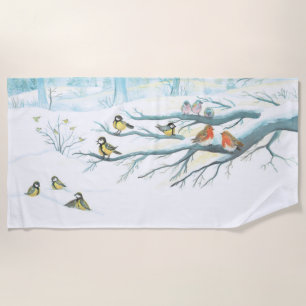 Winter birds in a snowy forest beach towel