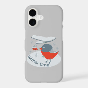 Winter bullfinch bird and red rowan berries