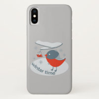 Winter bullfinch bird and red rowan berries