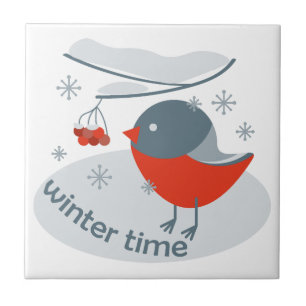 Winter bullfinch bird and red rowan berries ceramic tile