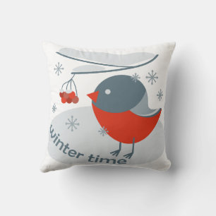 Winter bullfinch bird and red rowan berries cushion