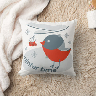 Winter bullfinch bird and red rowan berries cushion
