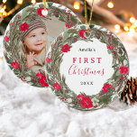 Winter festive wreath photo first Christmas  Ceramic Ornament<br><div class="desc">Celebrate Baby's first Christmas with this Winter festive wreath and script featuring elegant winter festive hand painted green pine branches, red flowers, and holy berries ornament , with white cream blooms and lush greenery leaves in a wreath with an elegant script font typography. Add your baby's photo at the back...</div>