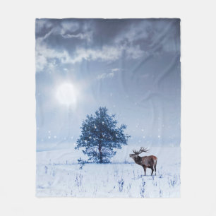 Winter landscape in blue colour. Lonely tree and w Fleece Blanket
