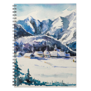 Winter landscape with mountain village covered wit notebook