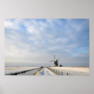 Winter landscape with snow and windmill in Holland Poster