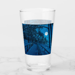 Winter landscape with snow covered pine forest glass