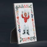 Winter Photo Plaque<br><div class="desc">Tabletop built-in photo easel features your favourite photo surrounded by snow and winter flowers - poinsettias, berries and leaves - on ANY COLOR BACKGROUND (we show blue.) Change the YEAR (in the lower right corner) or it can be deleted. Great as a gift or to display your favourite photo in...</div>