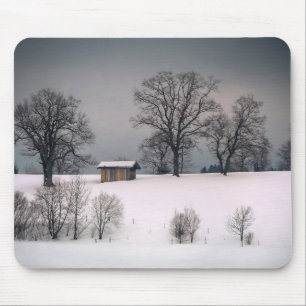 Winter scene, hill and trees, hut mouse pad