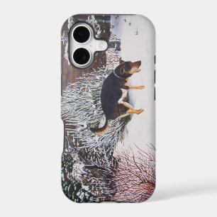 Winter snow scene with cute black and tan dog