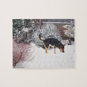 Winter snow scene with cute black and tan dog jigsaw puzzle