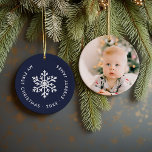 Winter Snowflake First Christmas Keepsake Photo Ceramic Ornament<br><div class="desc">Ceramic holiday ornament personalised with your baby's photo and custom "My First Christmas" text. This simple modern holiday design features a white snowflake on a navy blue background. Use the design tools to choose any background colour, edit text fonts and colours and add your own photos to create your own...</div>