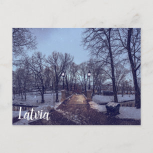 Winter snowy city park in the evening postcard