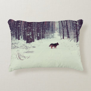 Winter snowy pine forest, dog walking in the fores decorative cushion