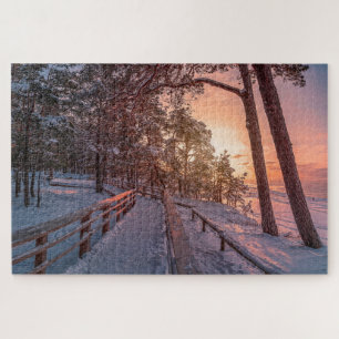 Winter sunset in pine forest near sea jigsaw puzzl puzzle