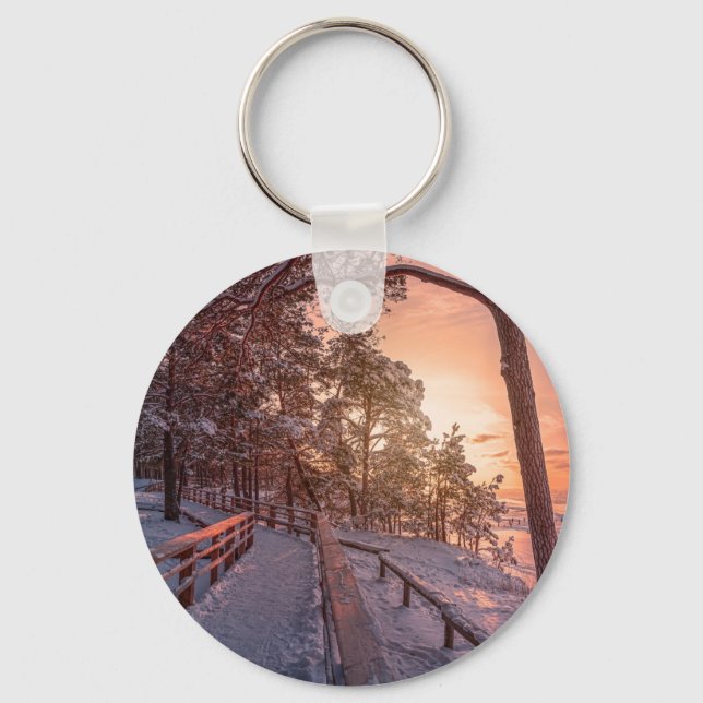 Winter sunset in pine forest near sea key ring (Front)