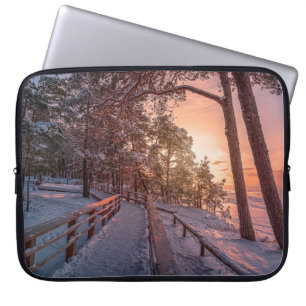 Winter sunset in pine forest near sea laptop sleeve
