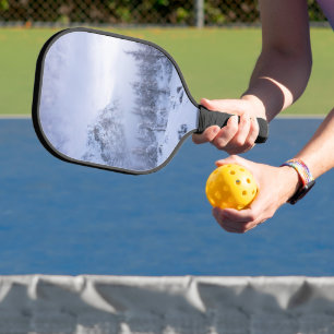 Winter wonderland, fog, spruce forest and mountain pickleball paddle