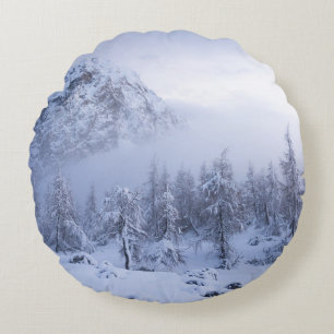 Winter wonderland, fog, spruce forest and mountain round cushion
